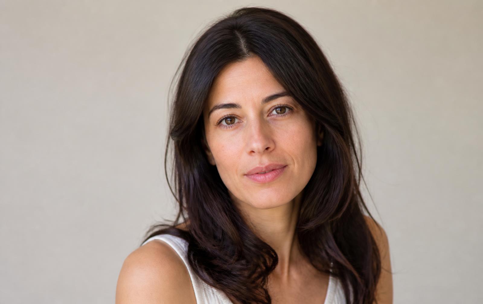 Woman with naturally balanced, hydrated-looking lips after subtle dermal filler treatment